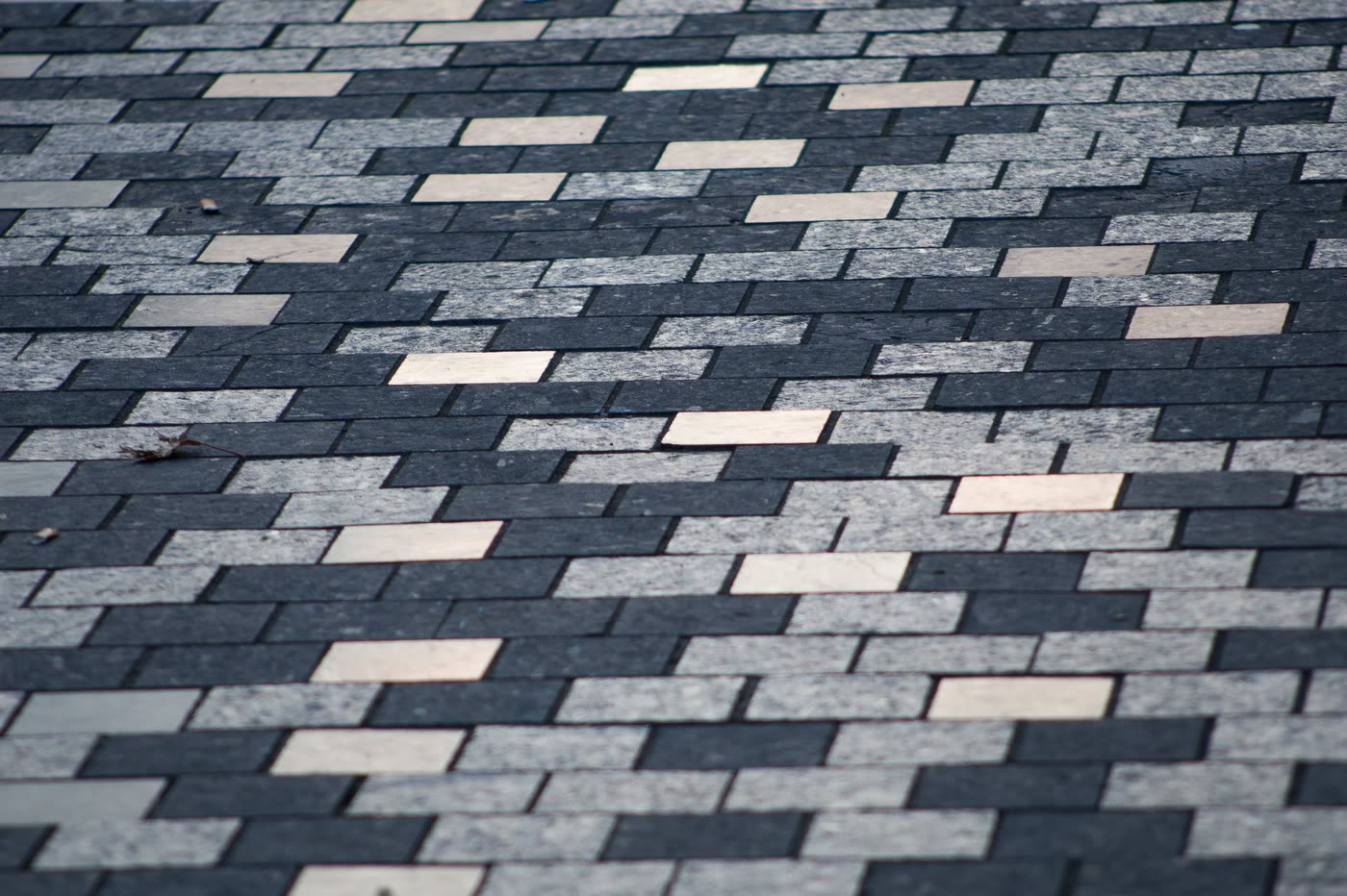 Sawn granite setts laid in a stretcher bond with tight joints